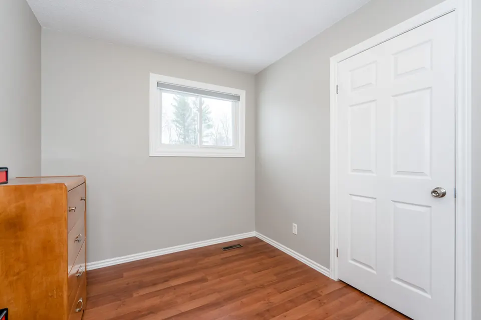 A small home office freshly painted in a light neutral
