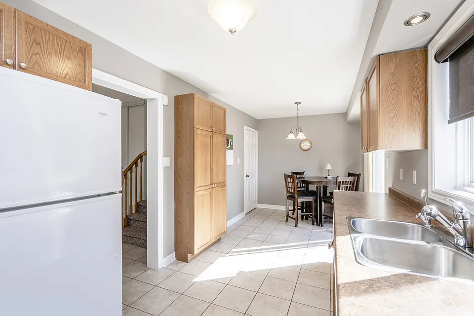 A kitchen and breakfast area painted in a soft neutral